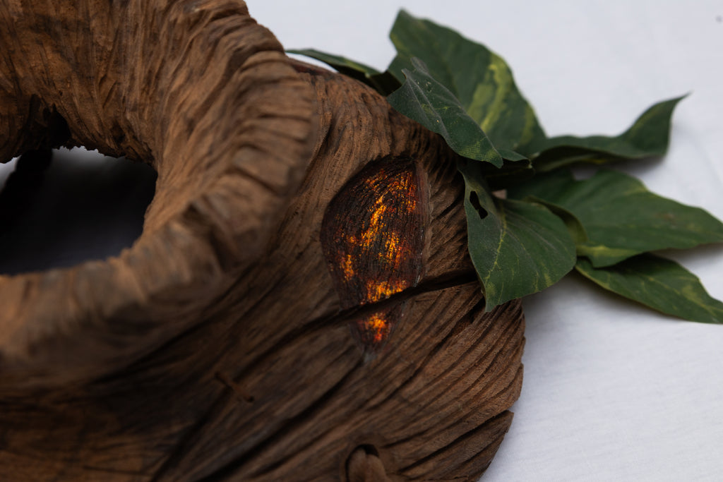Close up of the side profile of the Wooden Deku Mask