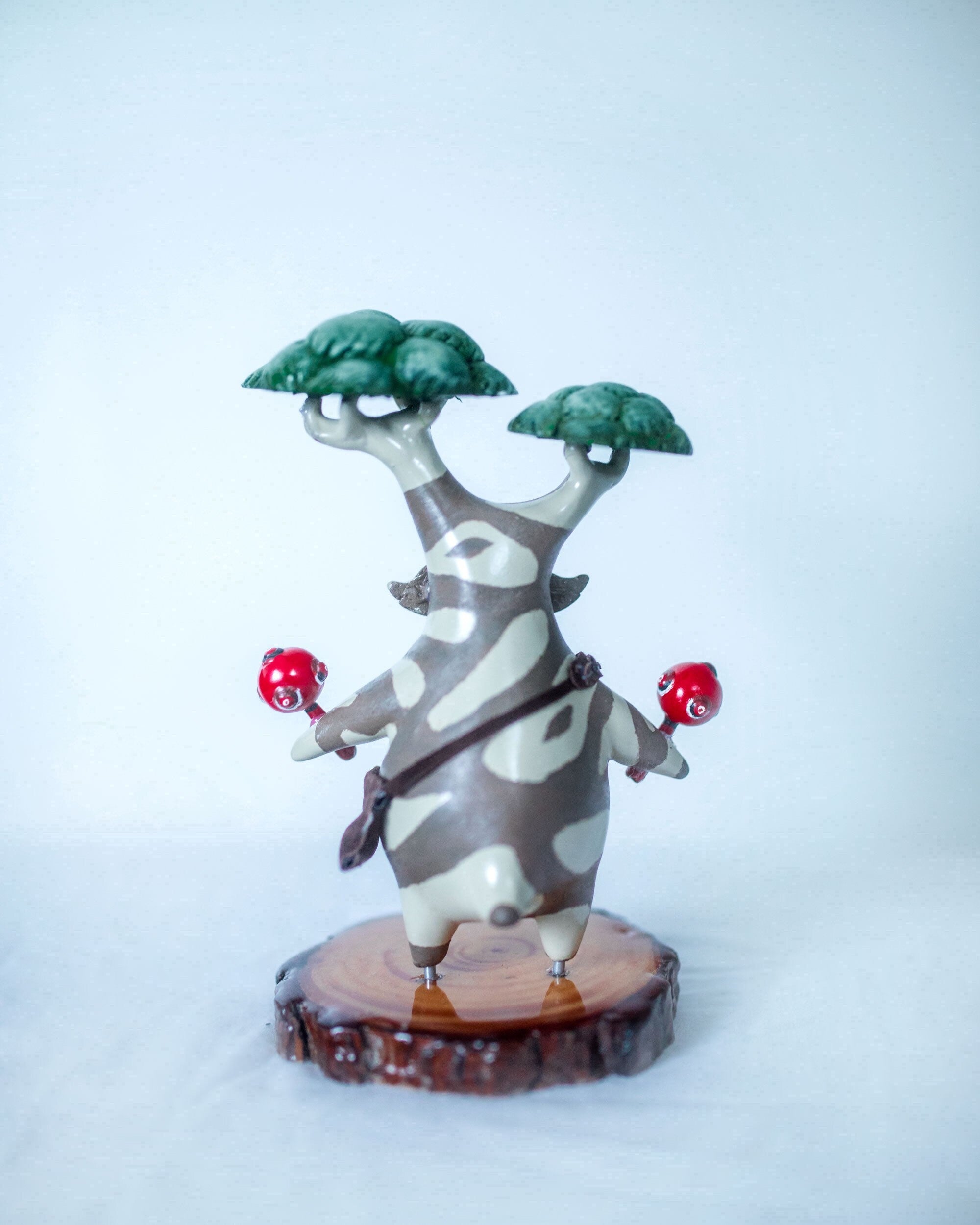 Back of Hestu sculpture against a white background