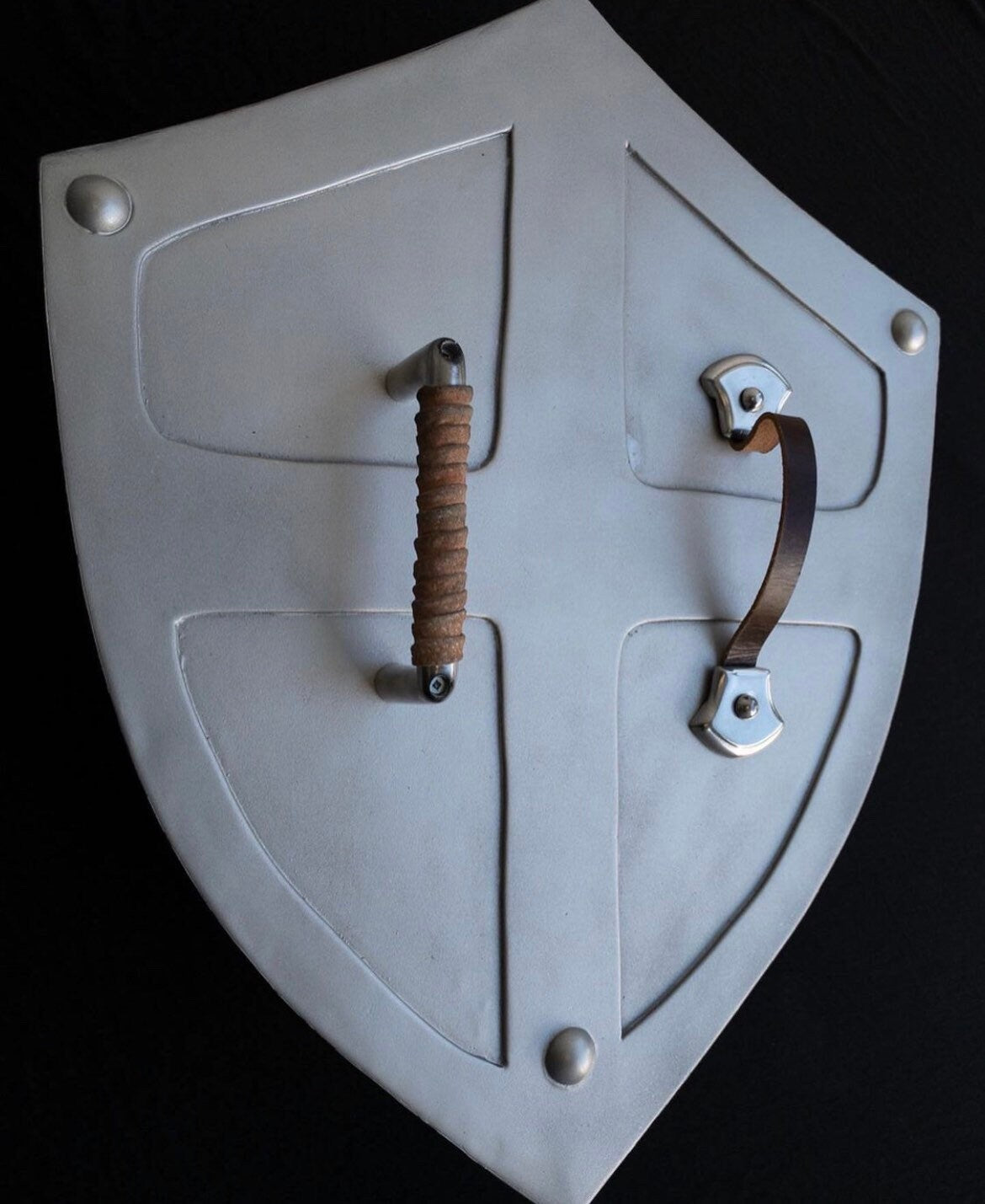 Shield with two handles on a black background