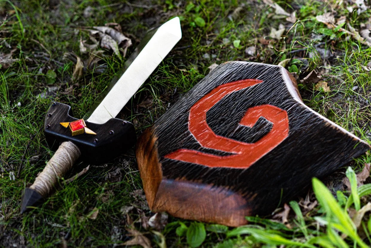 Wooden Kokiri sword and Wooden Deku Shield with a red symbol on a grassy background